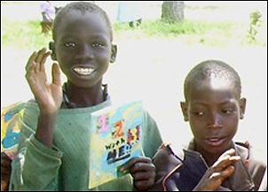 Boys with a book from U.S. students.