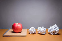 crumpled paper and apple