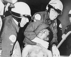 Police arrest a man during the 1965 Watts riots