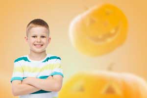 Boy surrounded by jack-o-lantern images