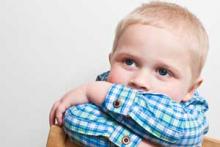 Kid with head down