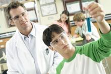 teacher and student in chemistry class